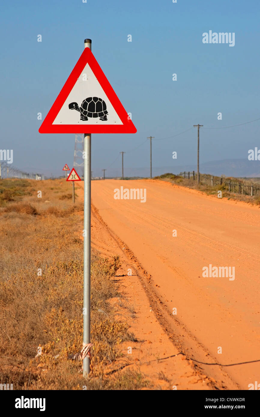traffic sign at a dusty road warning against turtle pass, South Africa Stock Photo