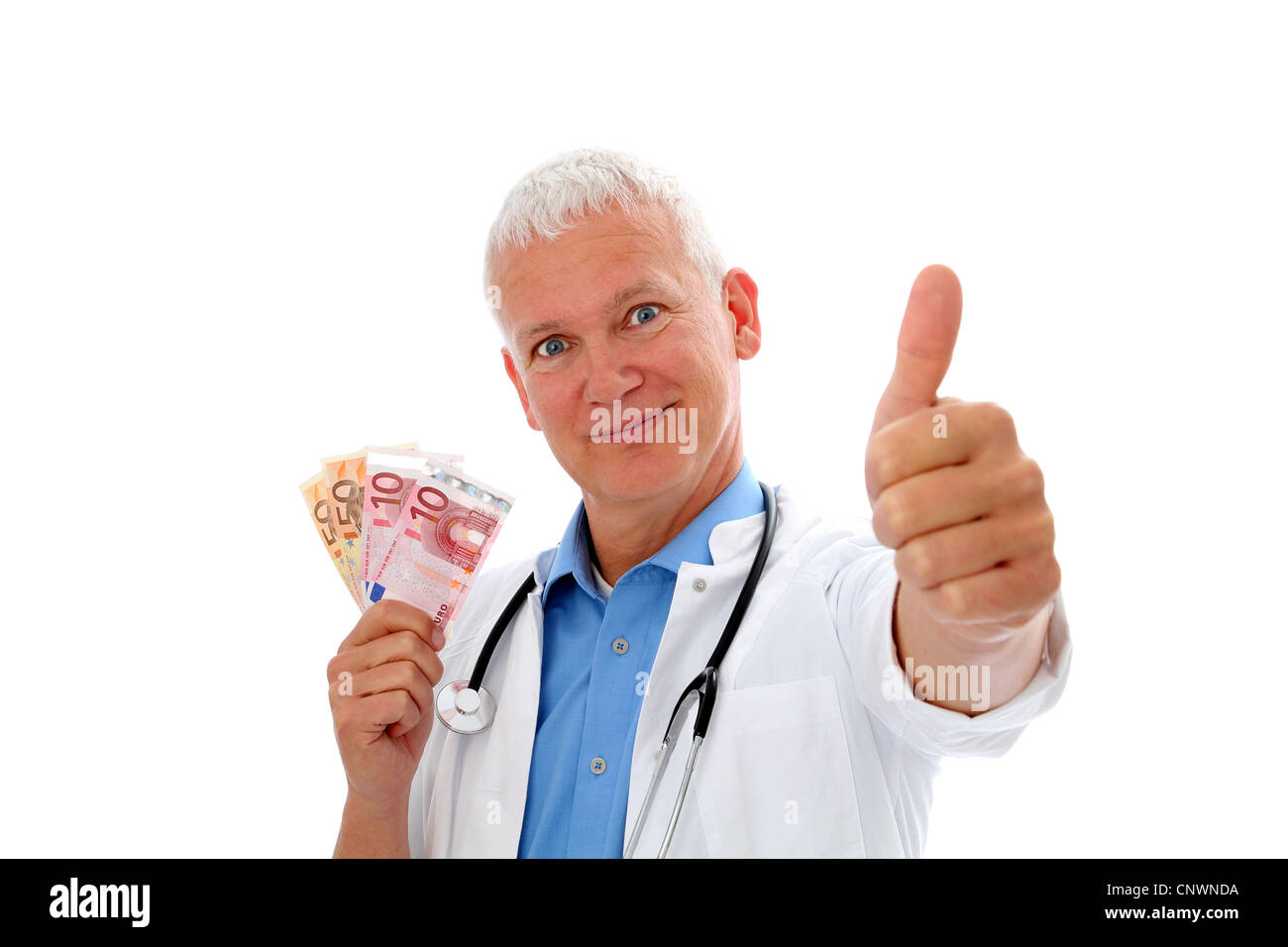 Smiling Doctor with money, stethoscope and thump up Stock Photo