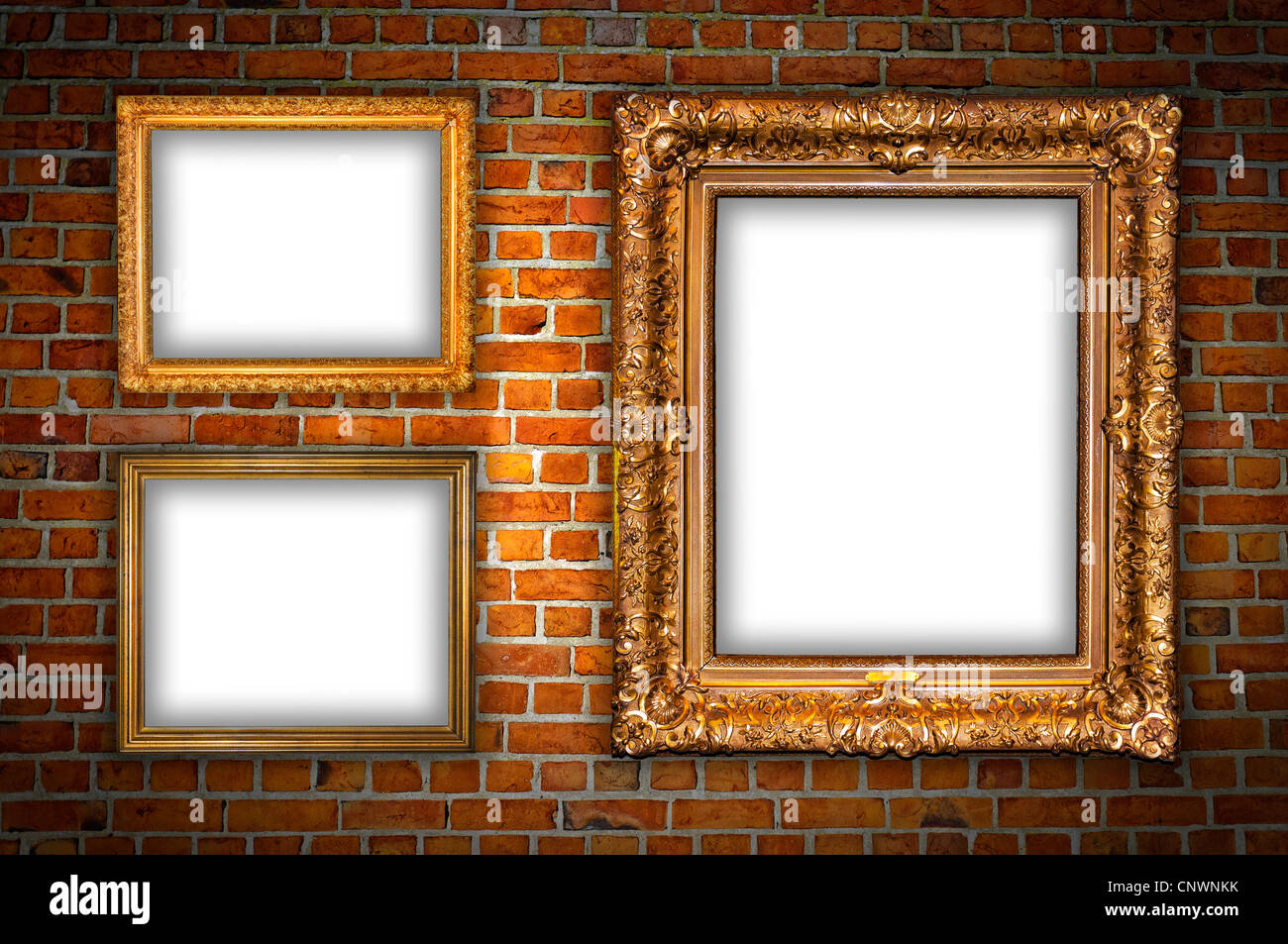 Old ornate golden frames hanging on a brick wall Stock Photo Alamy
