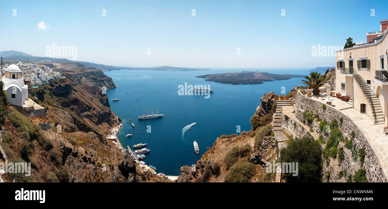A panoramic image from Santorini of the villages of Fira and Firastefani with a view of the caldera in between them. Stock Photo