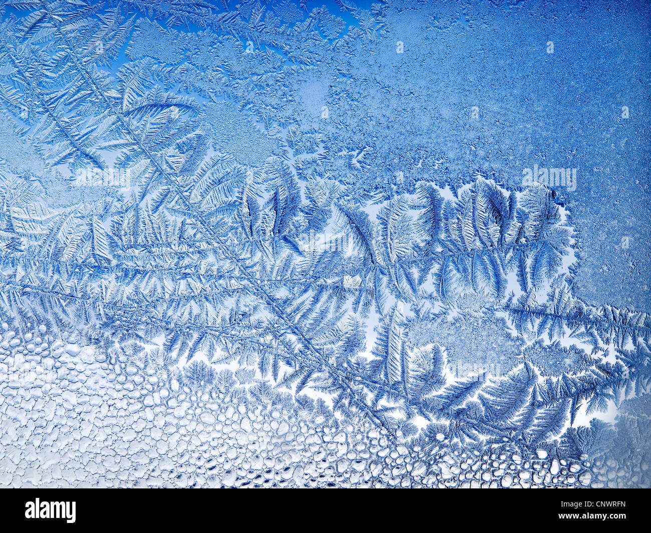 frost patterns on the window of a Norwegian mountain hut Stock Photo ...