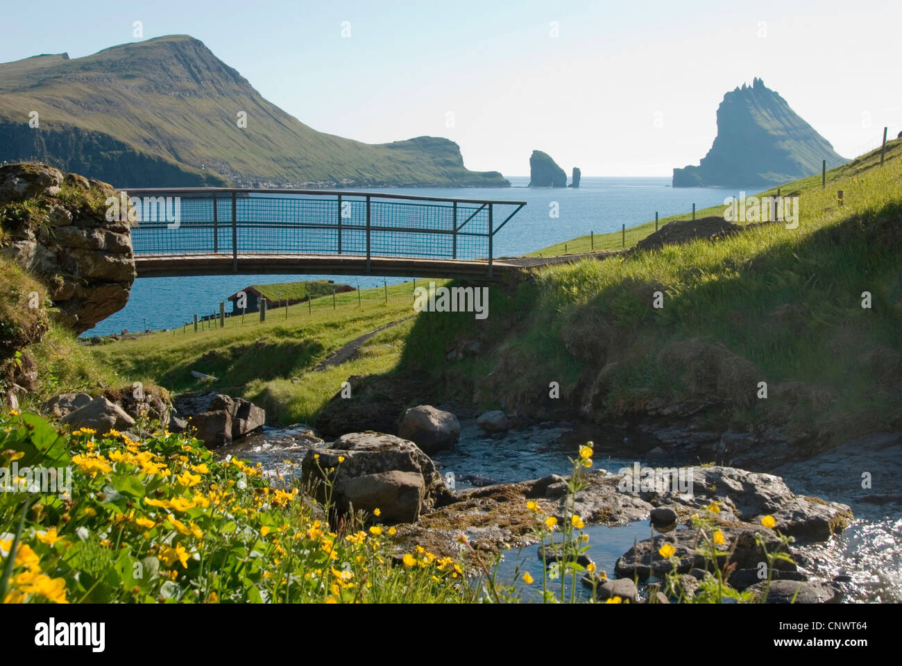 bridge over a creek in fiord Sorvagsfjoerdur, Denmark, Faroe Islands, Vagar Stock Photo