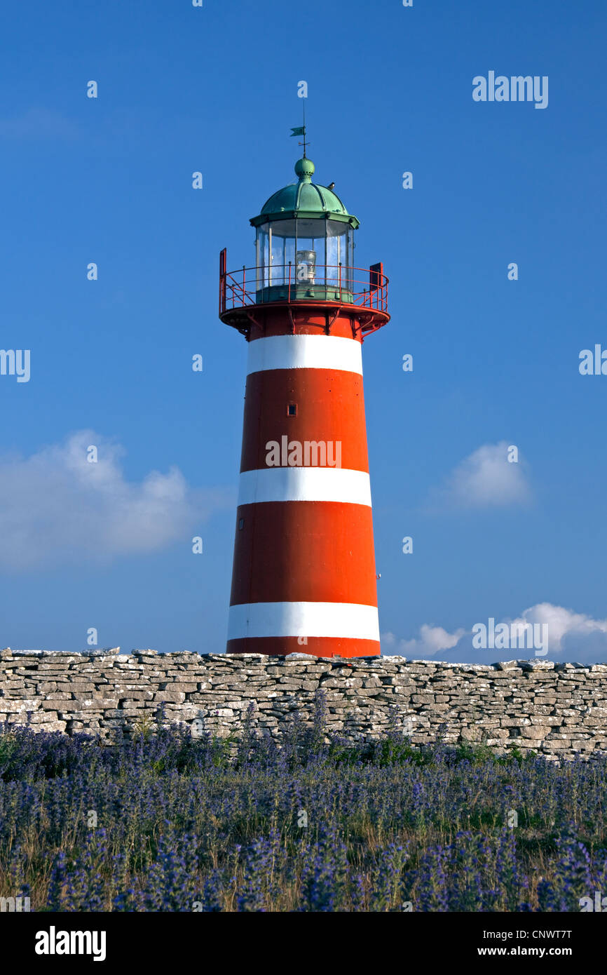 The red and white lighthouse Närs fyr at Närsholmen on the island Gotland, Sweden Stock Photo