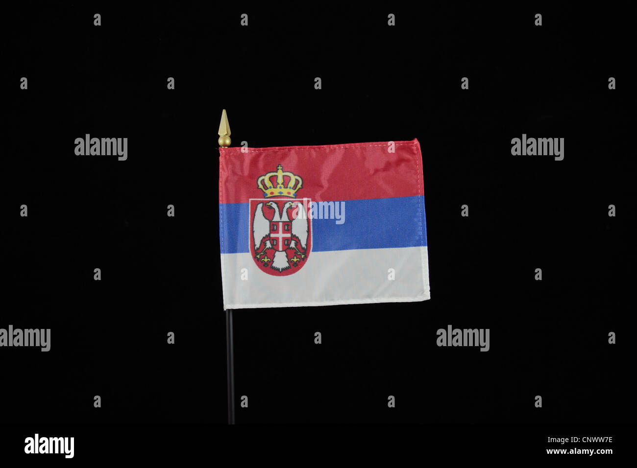 The national flag of Serbia on a black background. Stock Photo