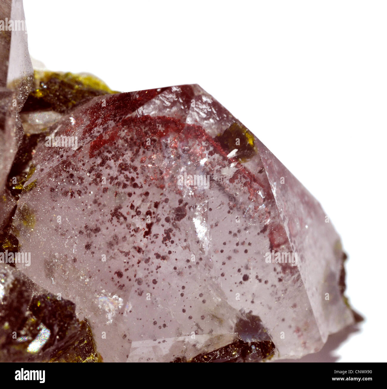 rock crystal with epidote crystals and inclusions of haematite Stock Photo
