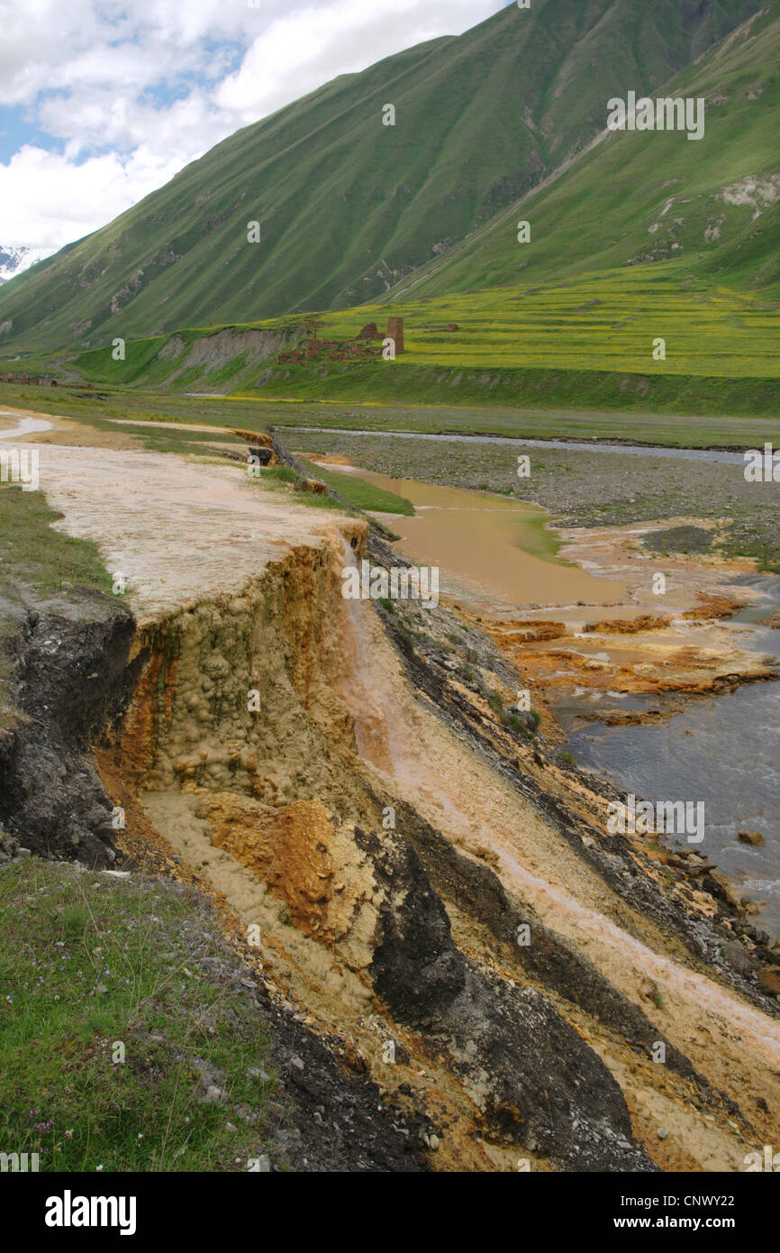 mineral wells with sinter terraces at a river bend with abandonned valley in the background, Georgia, Truso-Tal Stock Photo