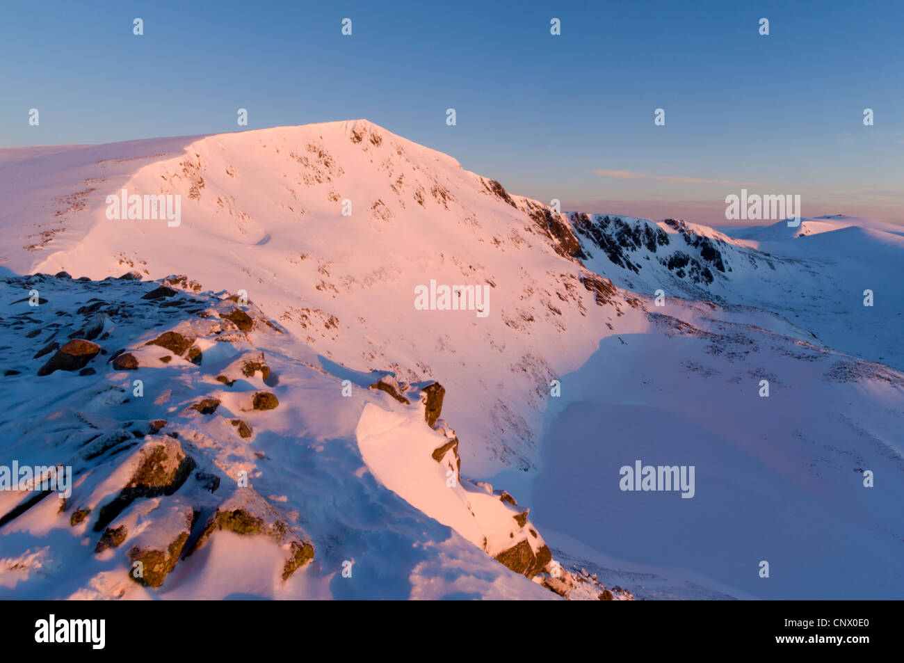 Ben Macdui (1309 metres) at daybreak, looking north across Coire Sputan Dearg (corrie) to Beinn Mheadhoin (1182 metres). Stock Photo