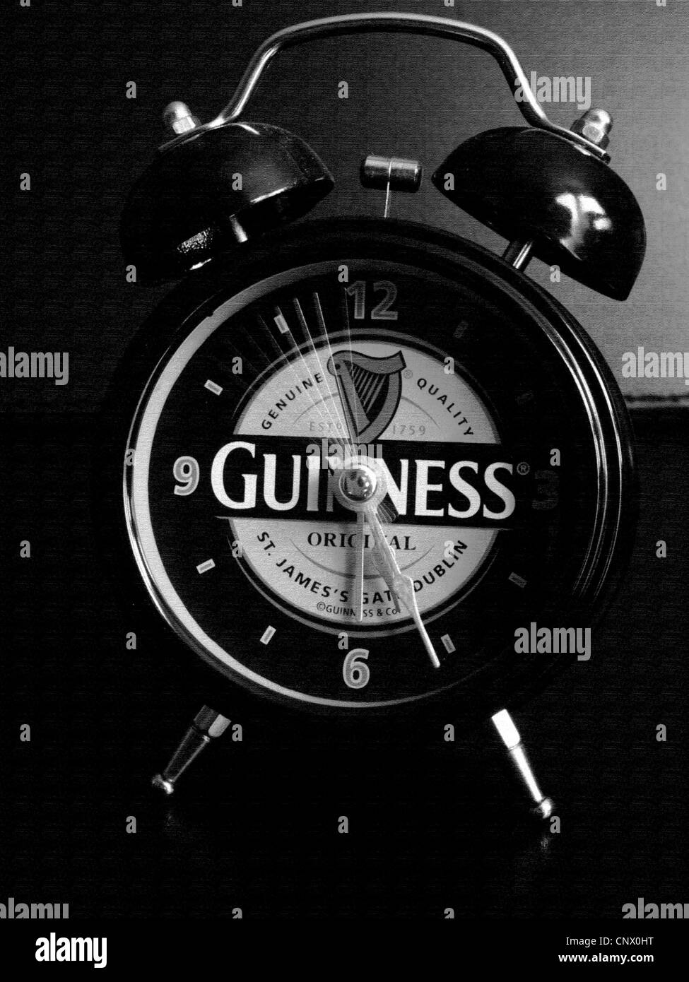 A Guinness clock showing the motion of the second hand shot in mono and with an effect of crayon canvas Stock Photo