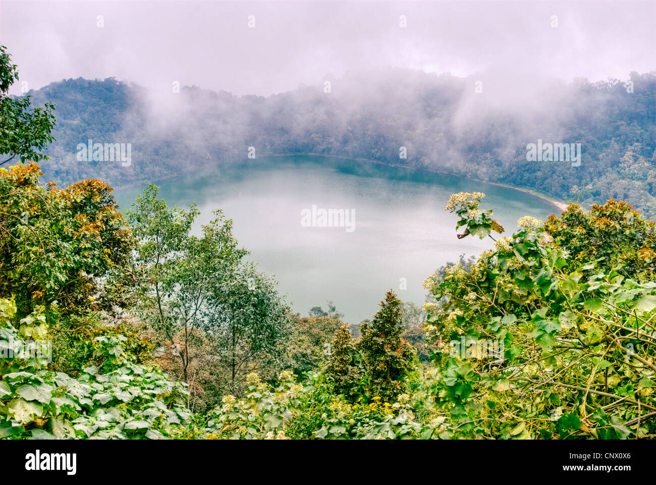 Guatemala's Laguna Chicabal lies in a volcanic crater and is considered sacred to the local Maya. Stock Photo