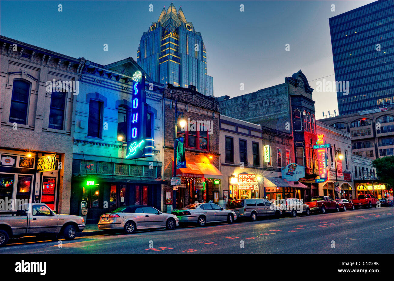 Austin's sixth street at dusk with the iconic Frost Tower in background. Stock Photo