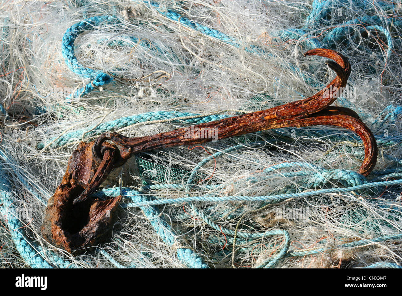 anchor on fishing net Stock Photo