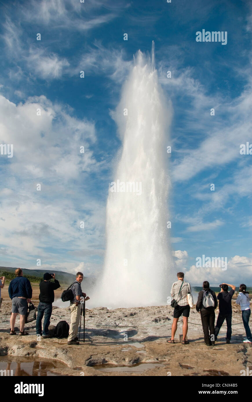 people at the water column of Stokkur geyser, Iceland, Haukadalur Stock Photo