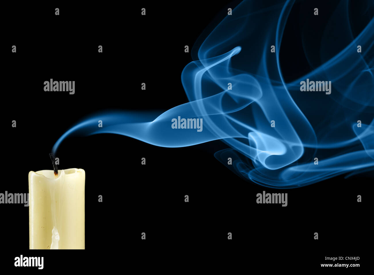Extinguished candle with smoke close-up Stock Photo