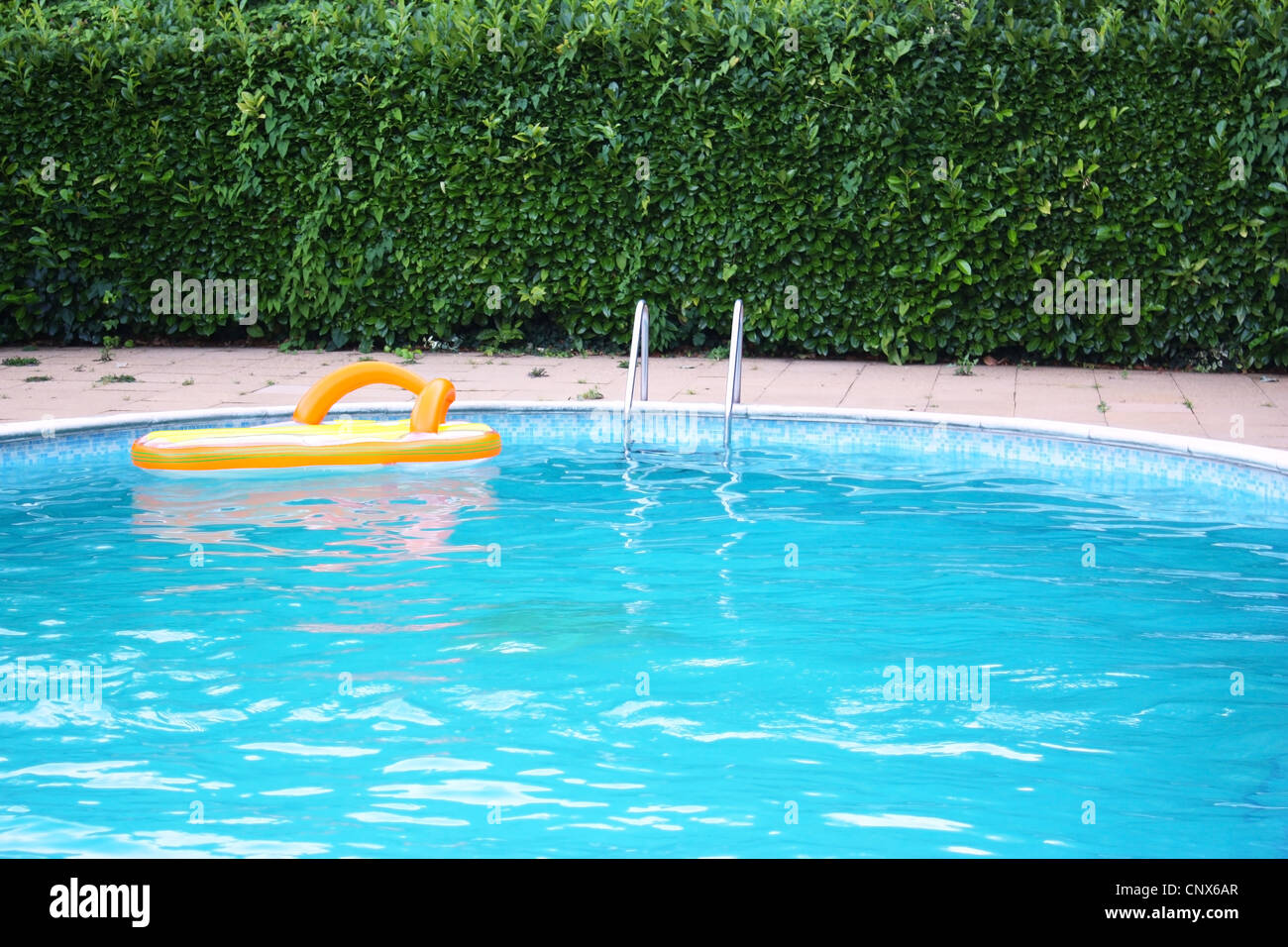 A float inside swimming pool water Stock Photo - Alamy