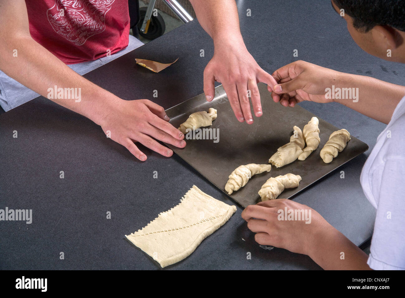 Teenage boy cooking class hires stock photography and images Alamy