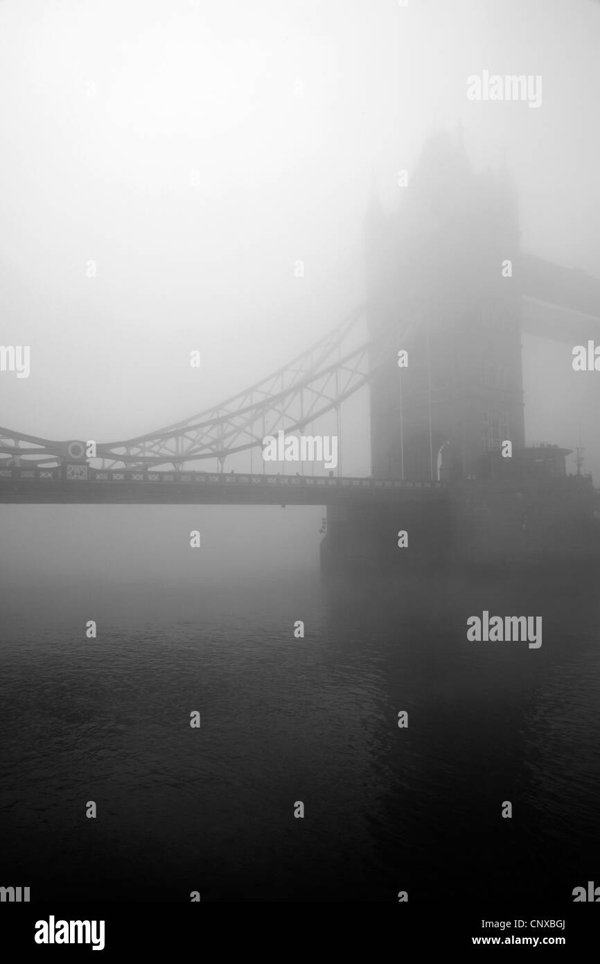 Tower Bridge shrouded in fog, City of London, UK Stock Photo