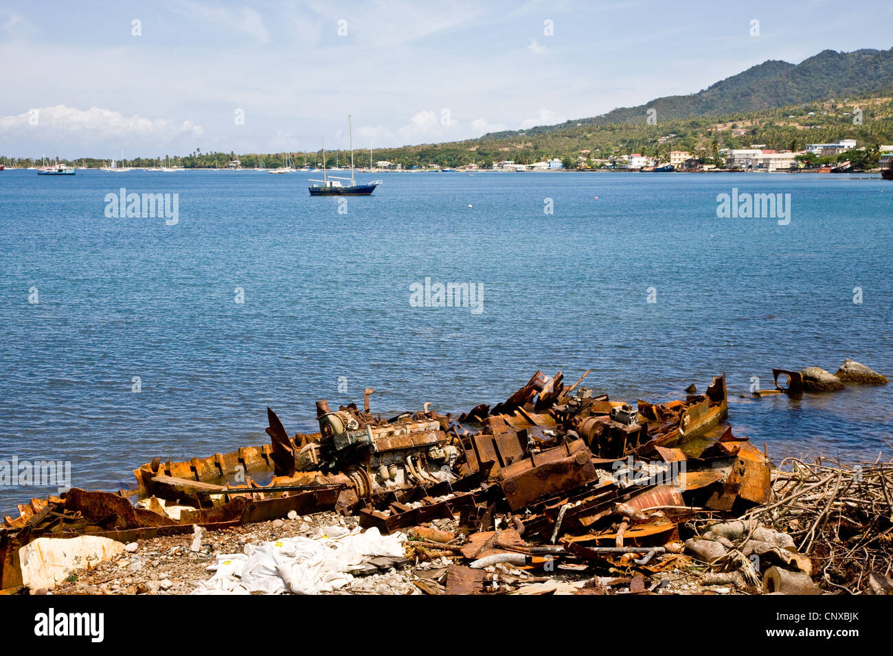 One of the many shipwrecks or abandoned ships that litter the coast along Prince Rupert's Bay Portsmouth Dominica West Indies Stock Photo