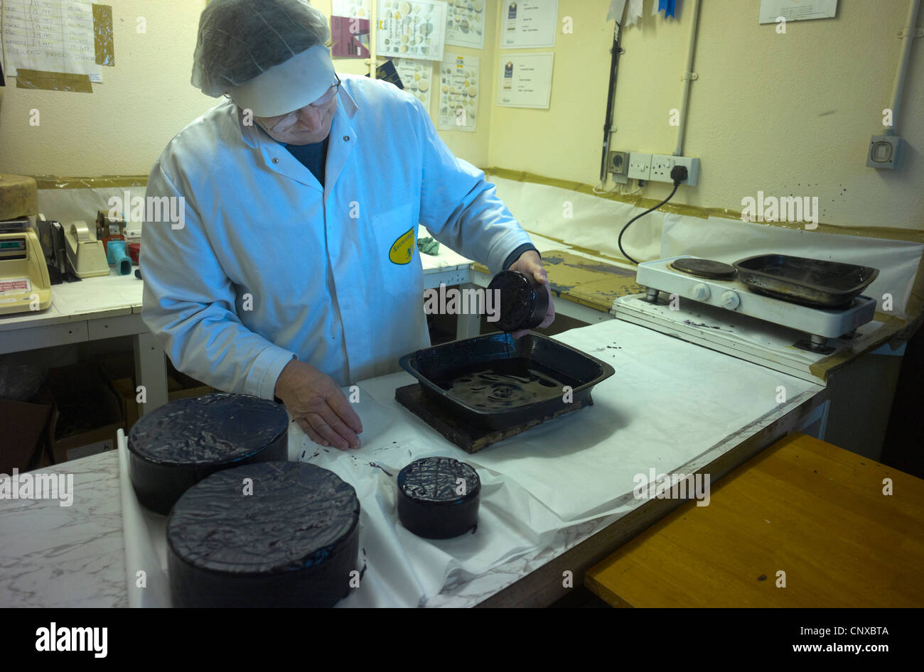 Cheese Making at Curworthy Farm Devon wax coating the matured cheese