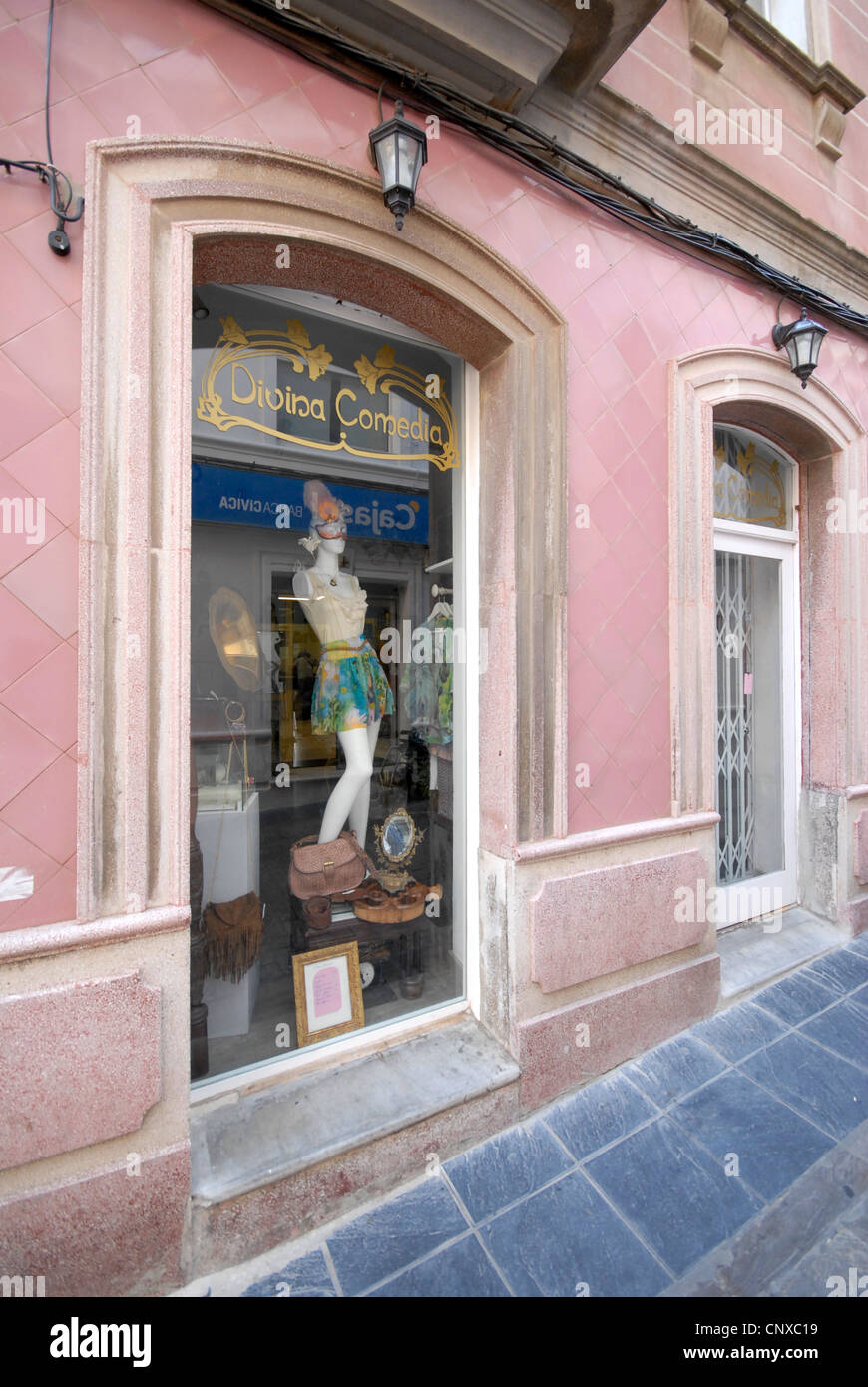 Vintage clothing and furniture shop with pink tiled frontage in Tarifa Old Town Stock Photo