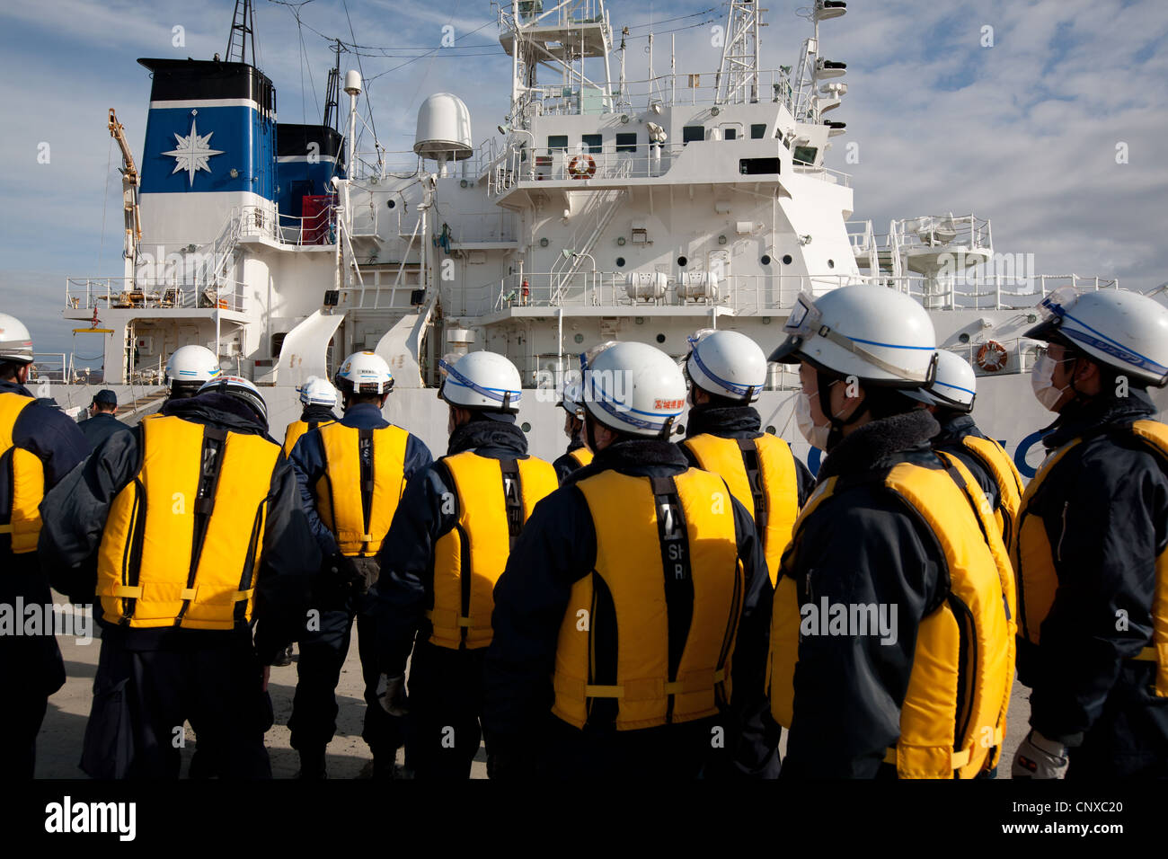 Japanese coast guard search underwater for the bodies of victims of the March2011 tsunami, in Kesennuma harbour, Tohoku, Japan. Stock Photo