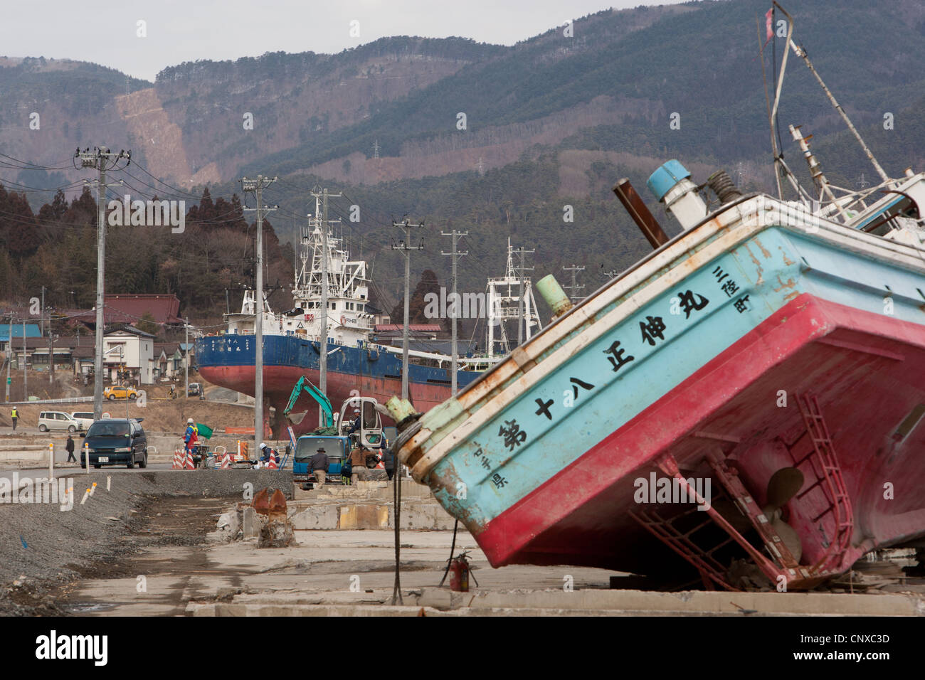 A fishing boat lays in Kesennuma, 100s of metres from the shore, washed in my the March2011 tsunami, in Tokhoku, Japan Stock Photo