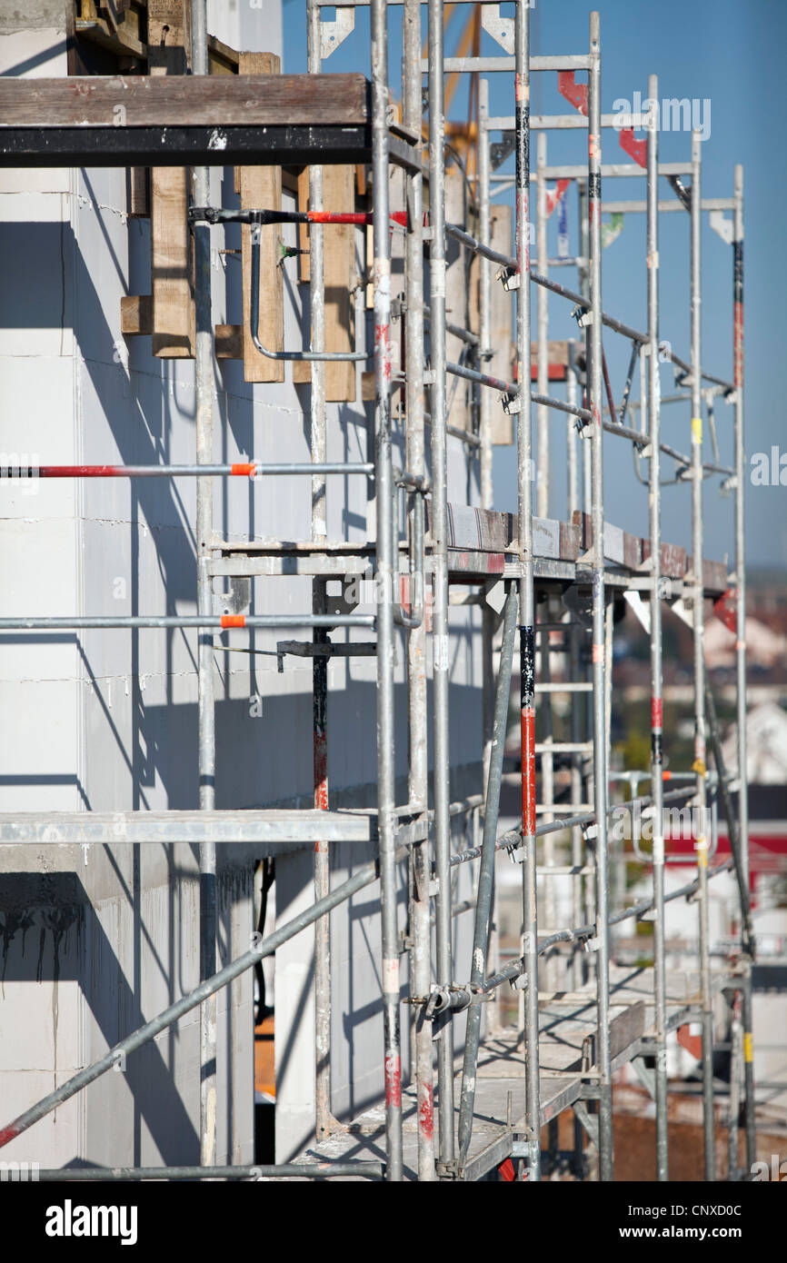 A tilt-shift shot of scaffolding on a building under construction Stock Photo