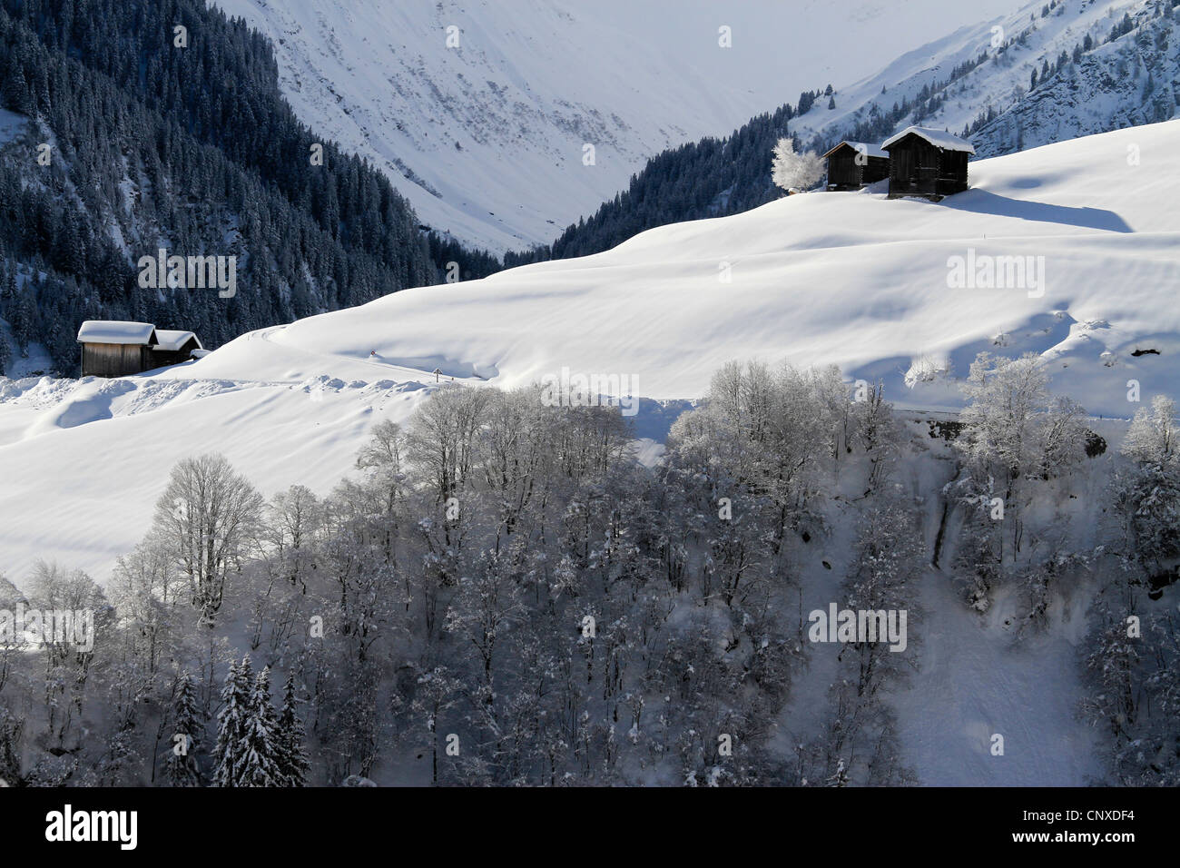 Winter landscape of mountain with log cabins Stock Photo - Alamy