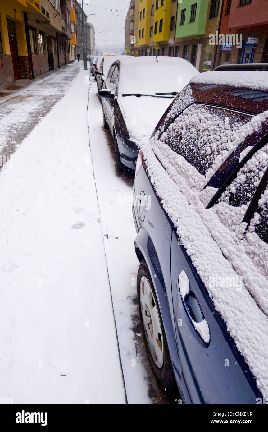 parked cars along a street, covered with snow Stock Photo - Alamy