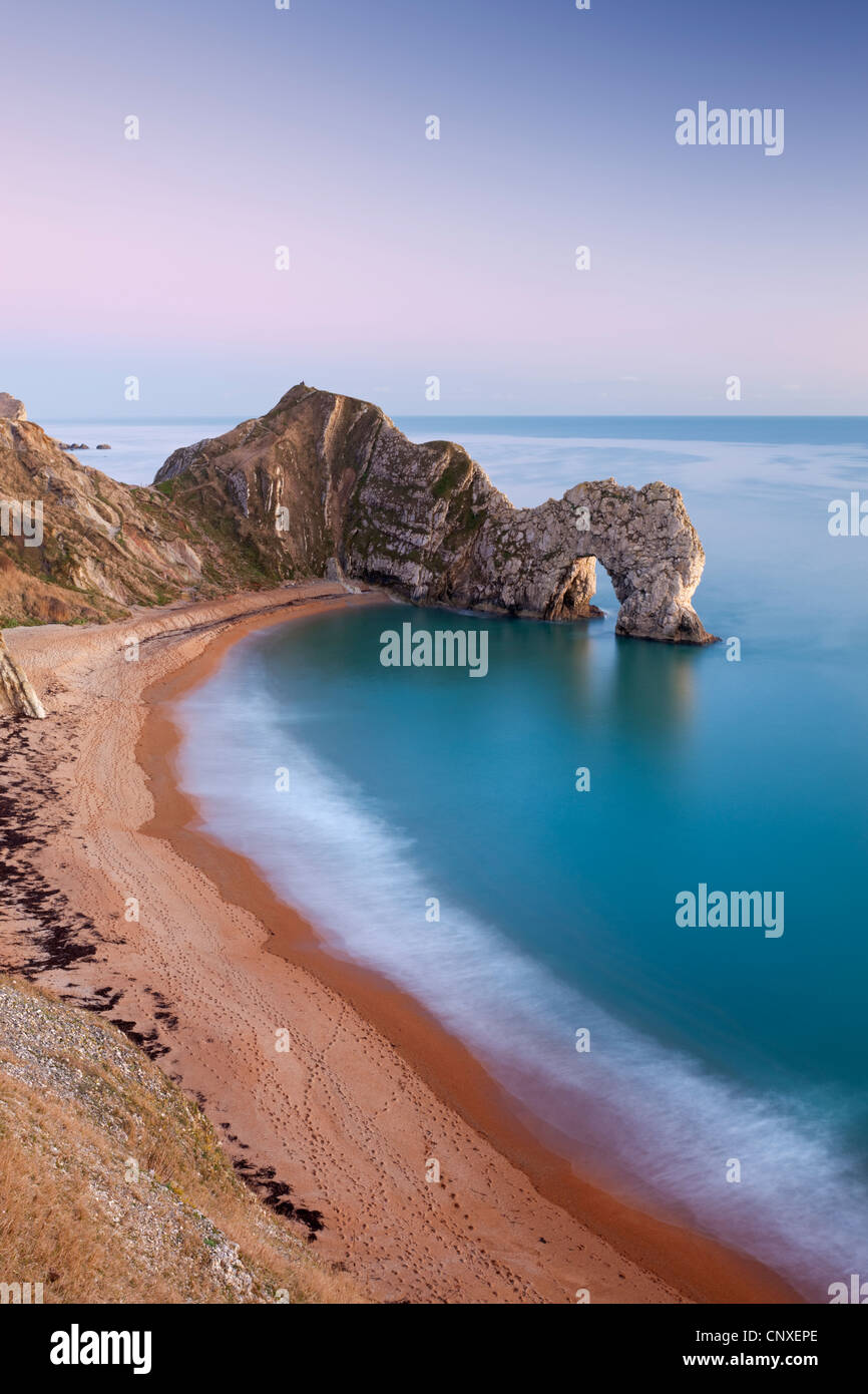 Deserted beach at twilight, Durdle Door, Dorset, England. Winter (January) 2011. Stock Photo