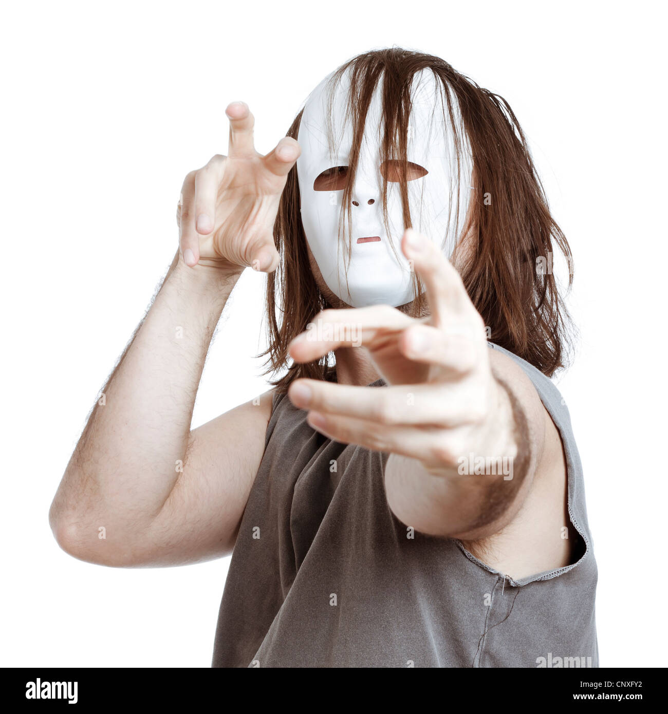 Insane scary masked man gesturing, isolated on white background. Stock Photo