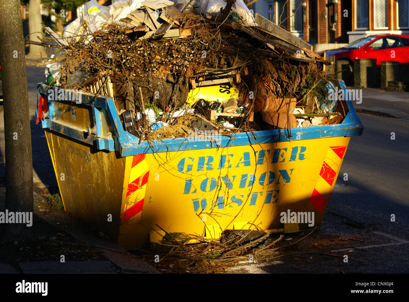 Overflowing rubbish skip, Enfield, London Stock Photo Alamy