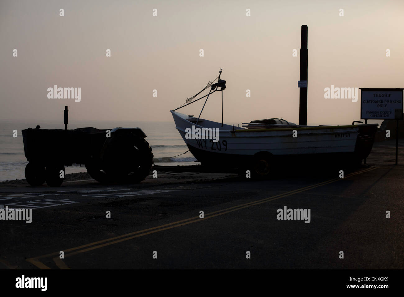 Tractor and Boat at Sunrise Stock Photo