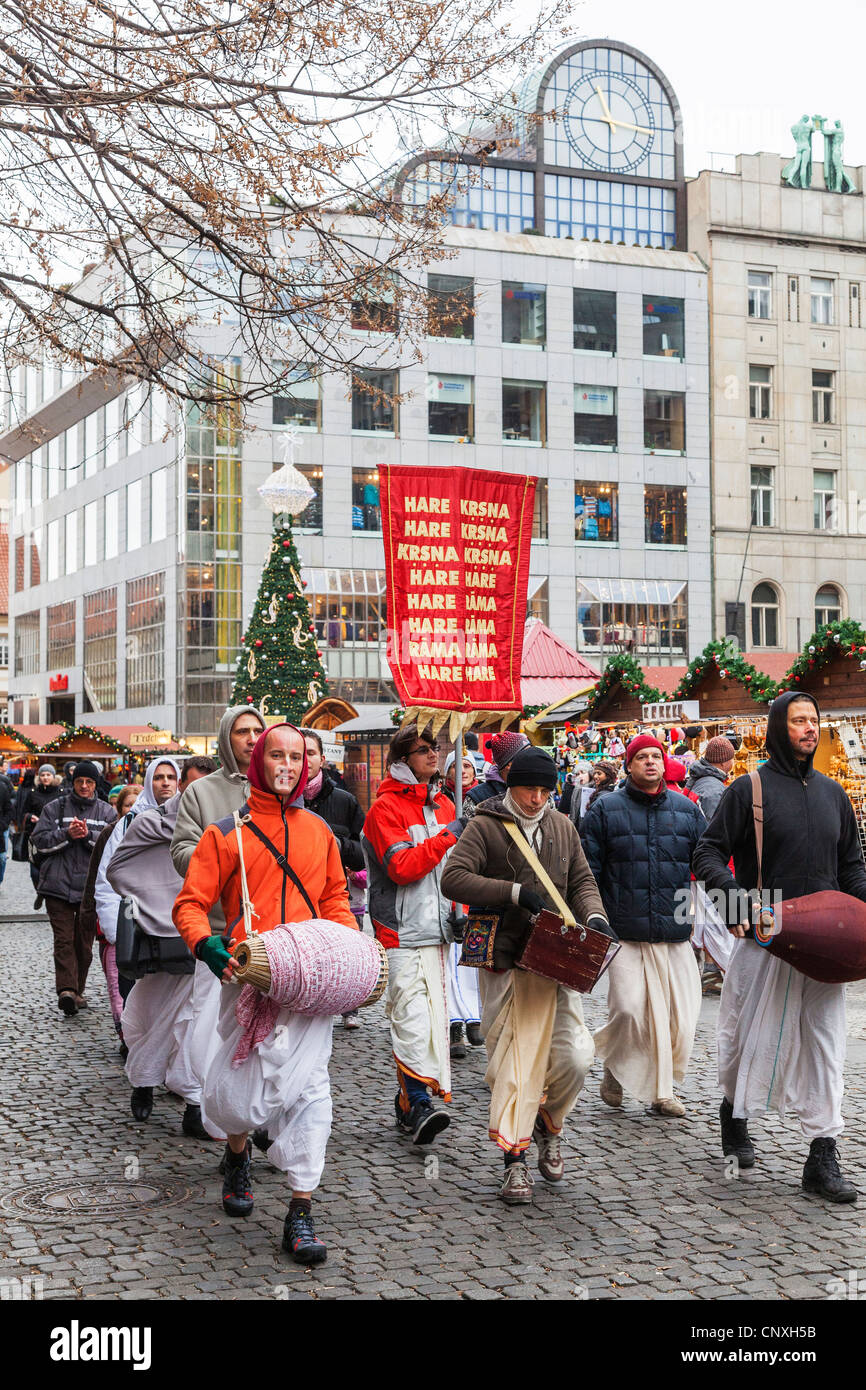 Hare Krishna followers, parading and chanting with drum in good humour with banners in Wenceslas Square, Prague, Czech Republic Stock Photo