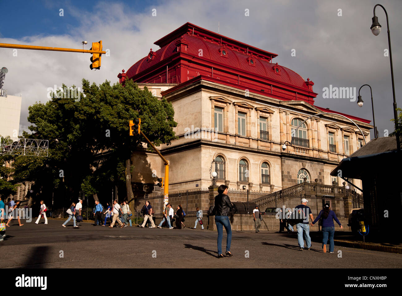 crossing with pedestrians and the national theater Teatro Nacional in the capital San Jose, Costa Rica, Central America Stock Photo
