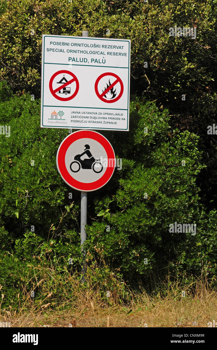sign at the edge of a bird reserve prohibiting biking, camping and making fire, Croatia, Istria Stock Photo