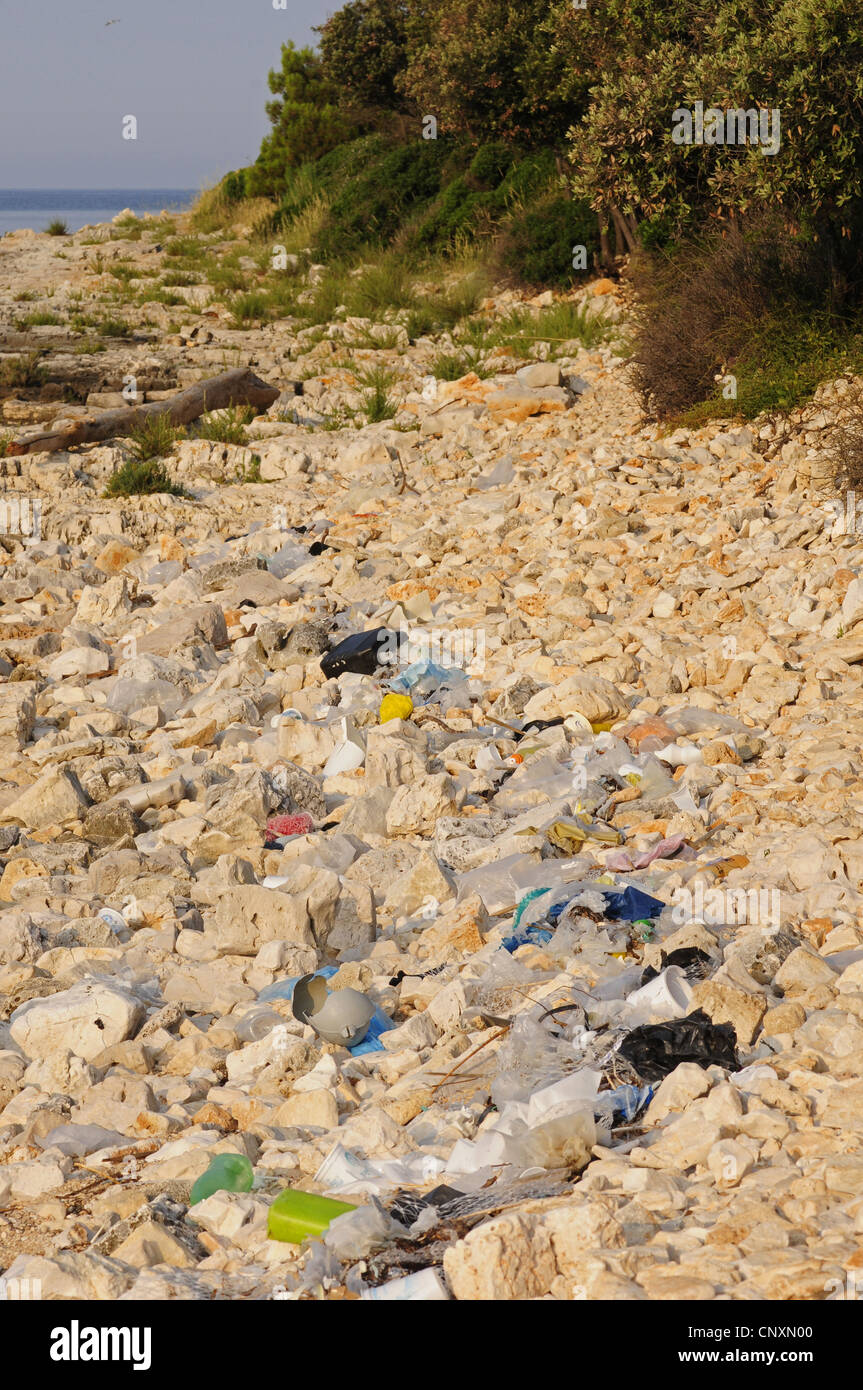 stony beach covered with stranded garbage, Croatia, Istria Stock Photo