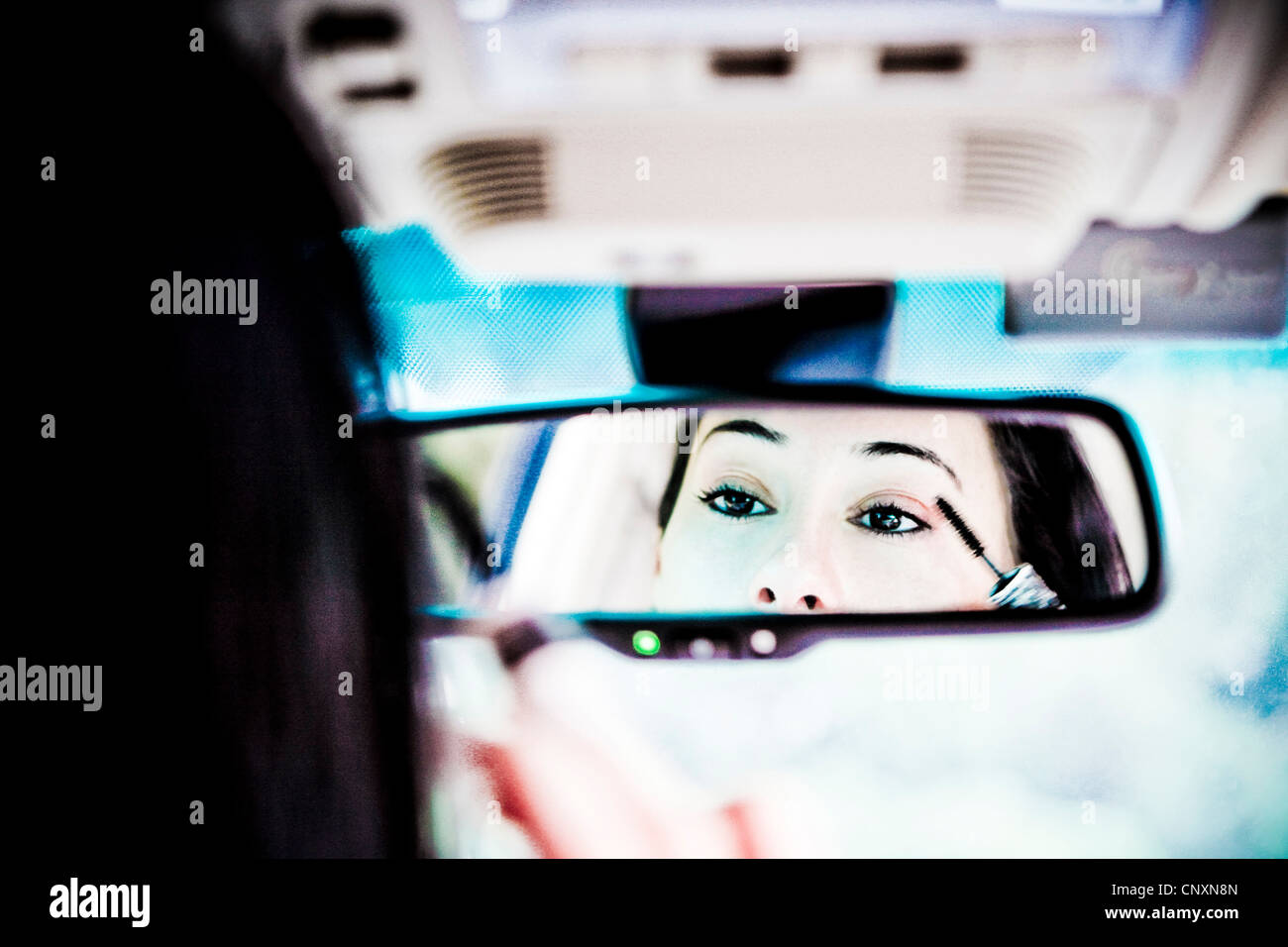 woman makeup in the car Stock Photo Alamy