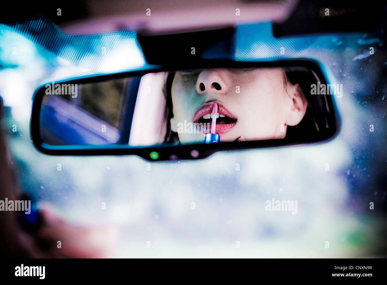 woman makeup in the car Stock Photo Alamy