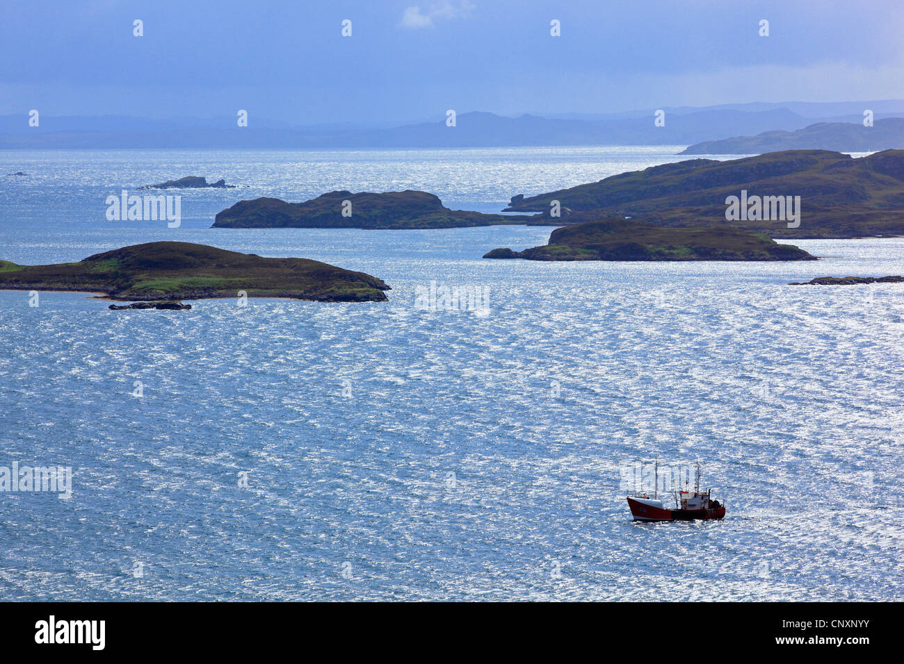 fishing trawler and coast landscape of Summer Isles, United Kingdom, Scotland, Achnahaid Bay Stock Photo