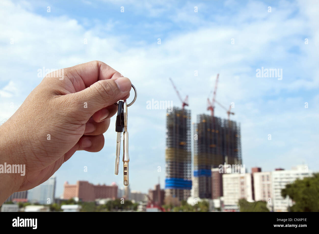 Real estate concept. Took the key Stock Photo