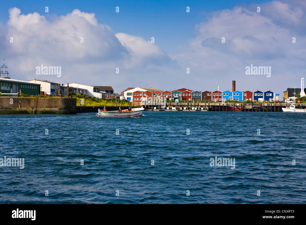 harbour with boats and colourful row of houses at the promenade, Germany, Schleswig-Holstein, Heligoland Stock Photo