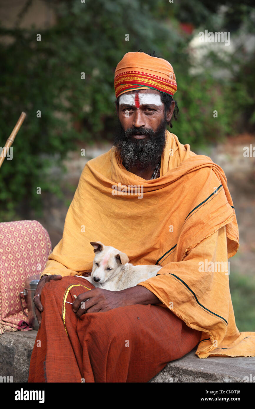 Sadhu with dog South India Stock Photo