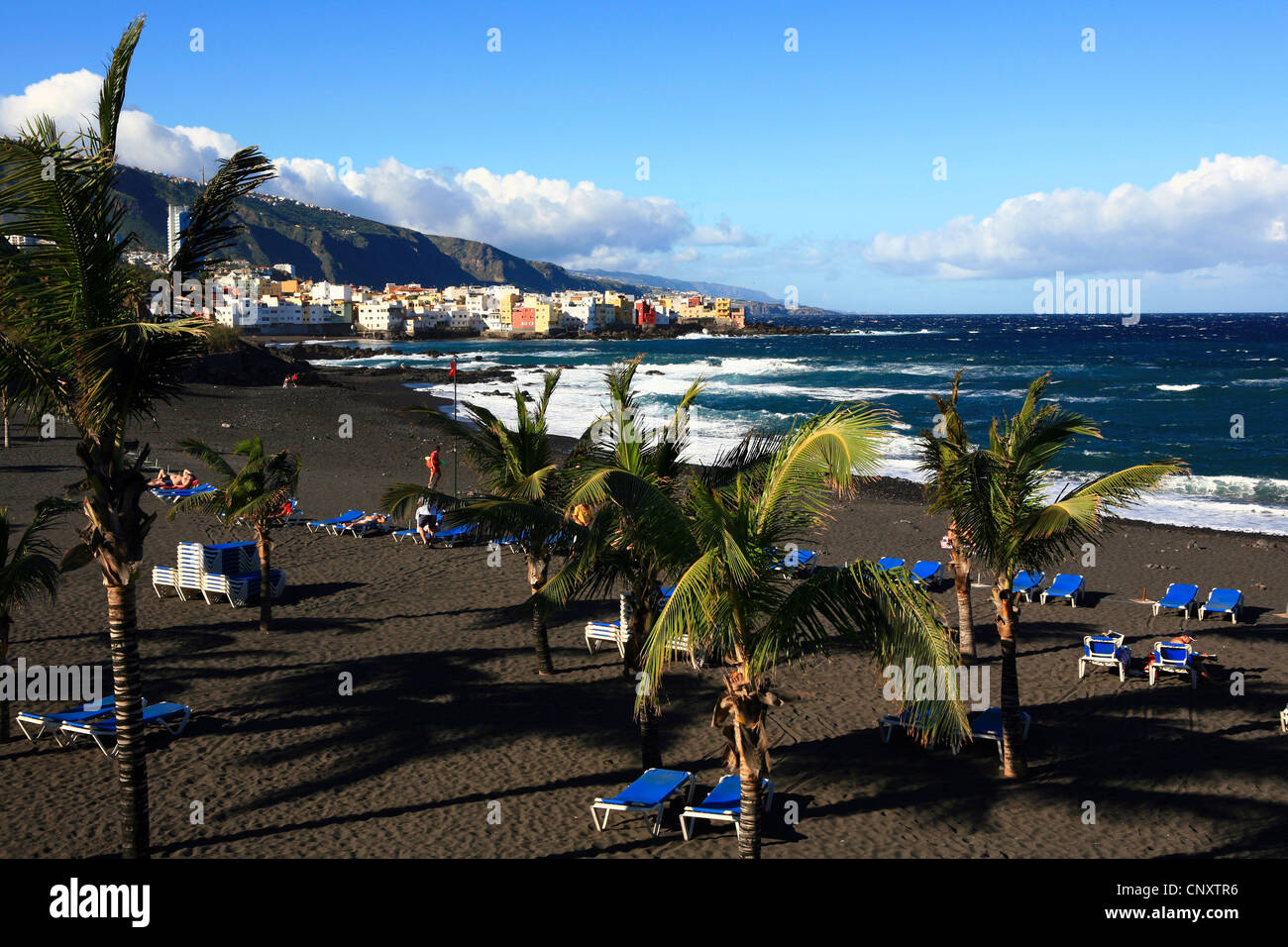 black lava sand at Playa Jardin, Punta Brava in background, Canary Islands, Tenerife, Punta Brava, Puerto De La Cruz Stock Photo