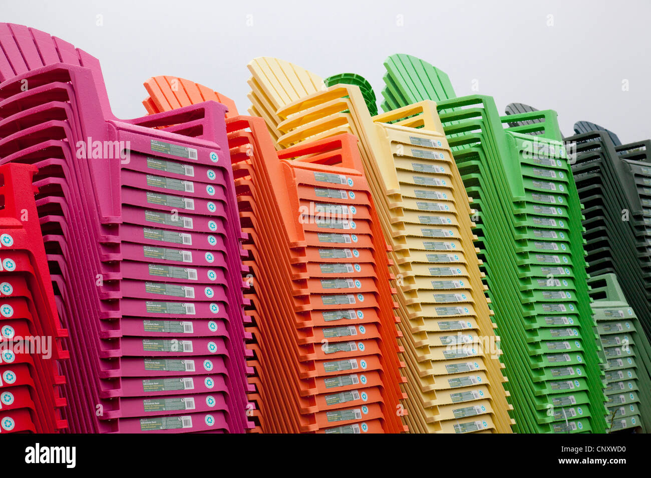 stack of colorful plastic Adirondack chairs Stock Photo Alamy