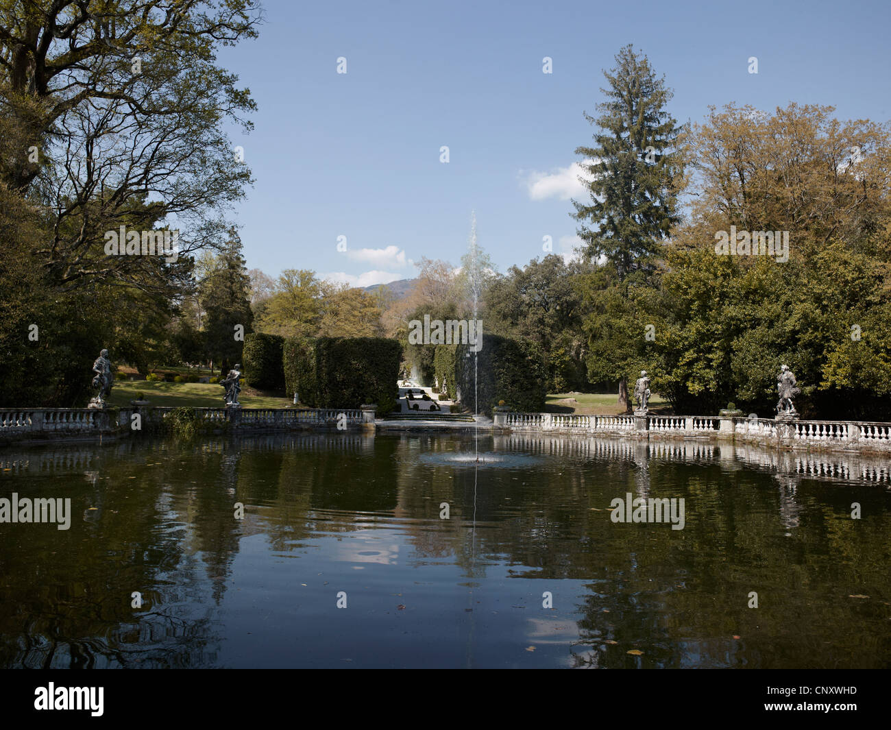 Villa Mansi, near Lucca, Italy. Formal water gardens with fishpond, fountain and balustrade with statues Stock Photo