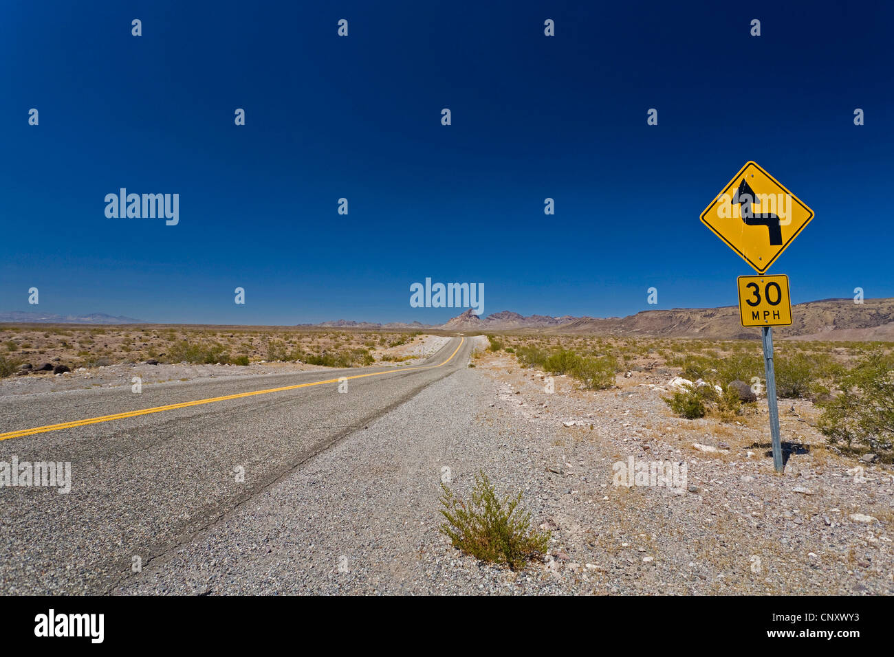 historical Route 66 with curvy road and speed limit signs, USA, Arizona Stock Photo
