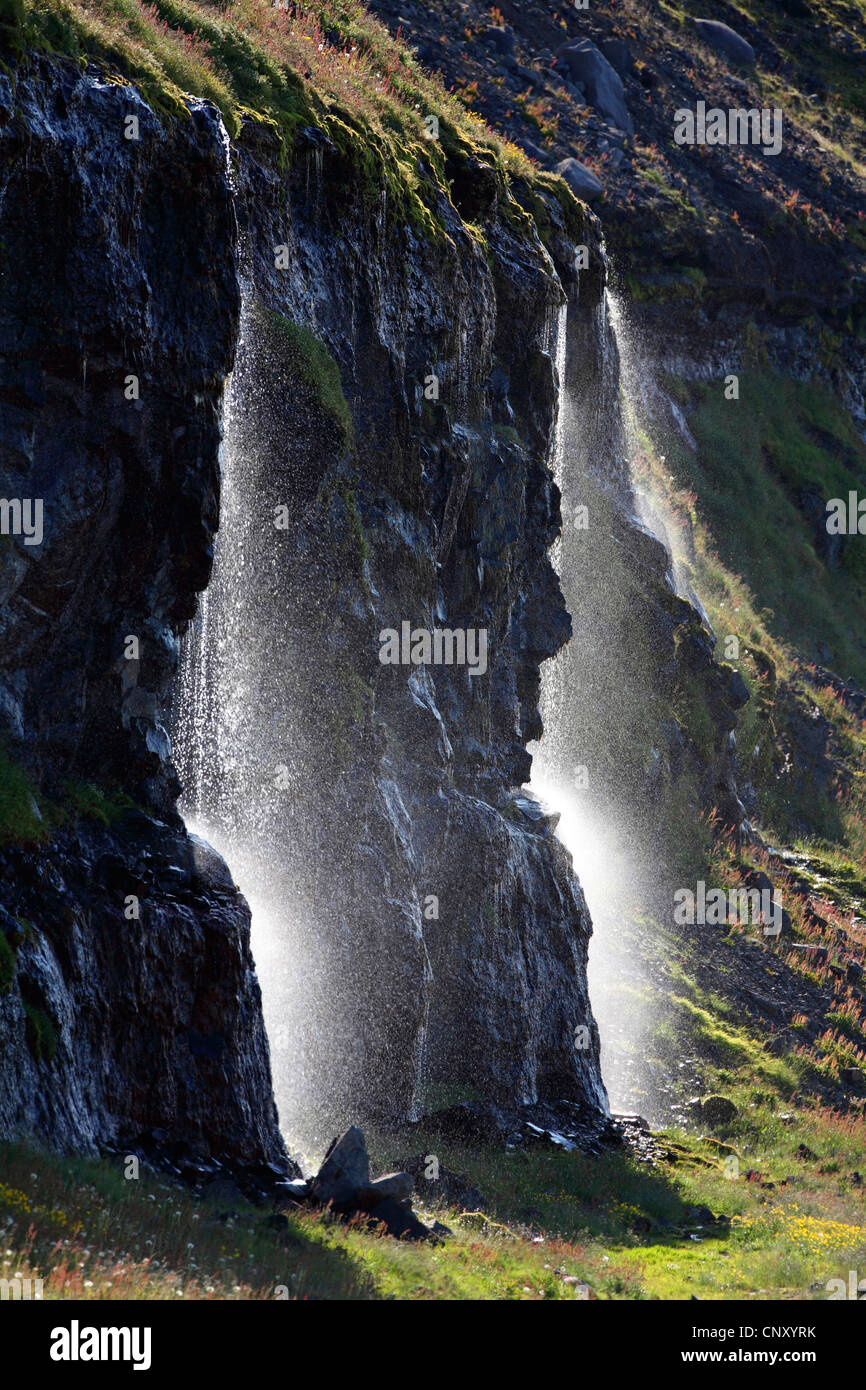 waterfall in back light, Iceland, Snaefellsnes, Olafsvik Stock Photo