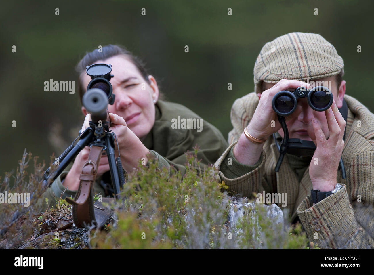 deer stalker and lady guest, United Kingdom, Scotland Stock Photo
