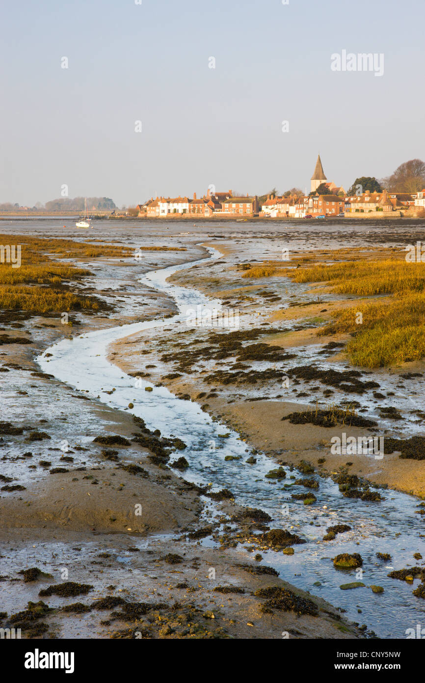 Low tide in Chichester Harbour, looking across to the ancient village of Bosham, West Sussex, England Stock Photo