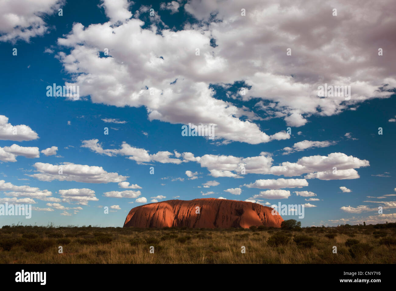 cloudy sky over Uluru (Ayers Rock), Australia, Northern Territory, Uluru-Kata Tjuta National Park Stock Photo